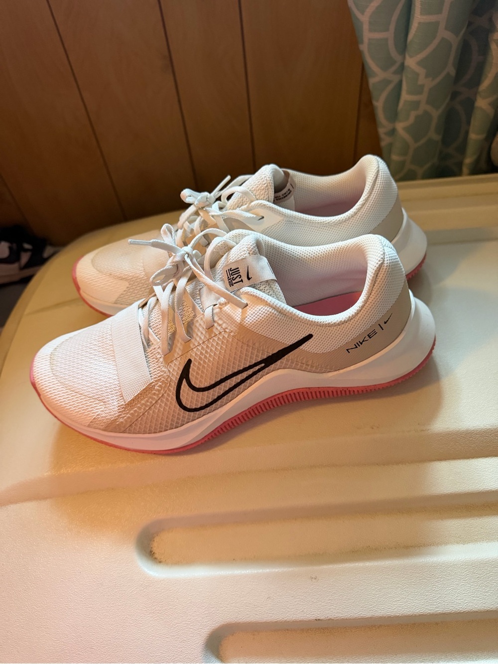 Nike Women’s White Athletic Sneakers with Pink Outsole and Black Swoosh